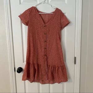Medium light red dress with white dots and functional buttons